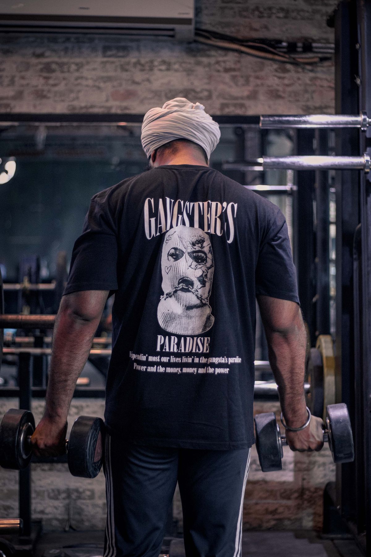 Sikh member lifting dumbbells in a Delhi gym