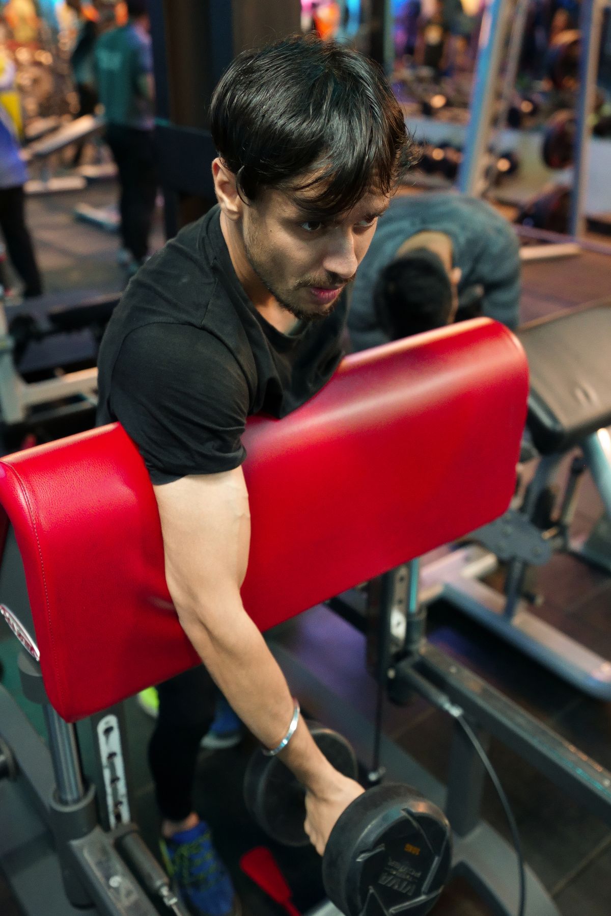 Indian member working out with a dumbbell